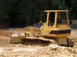 A building site preparation company helps clear the land for construction.
