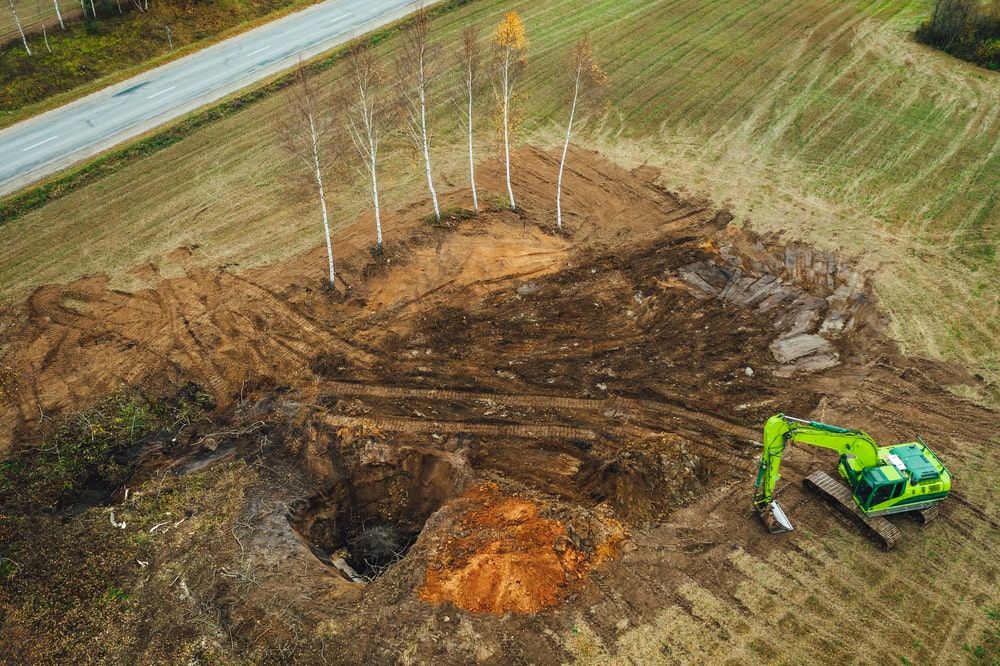 Topsoil excavation contractors remove the uppermost layer of the worksite.